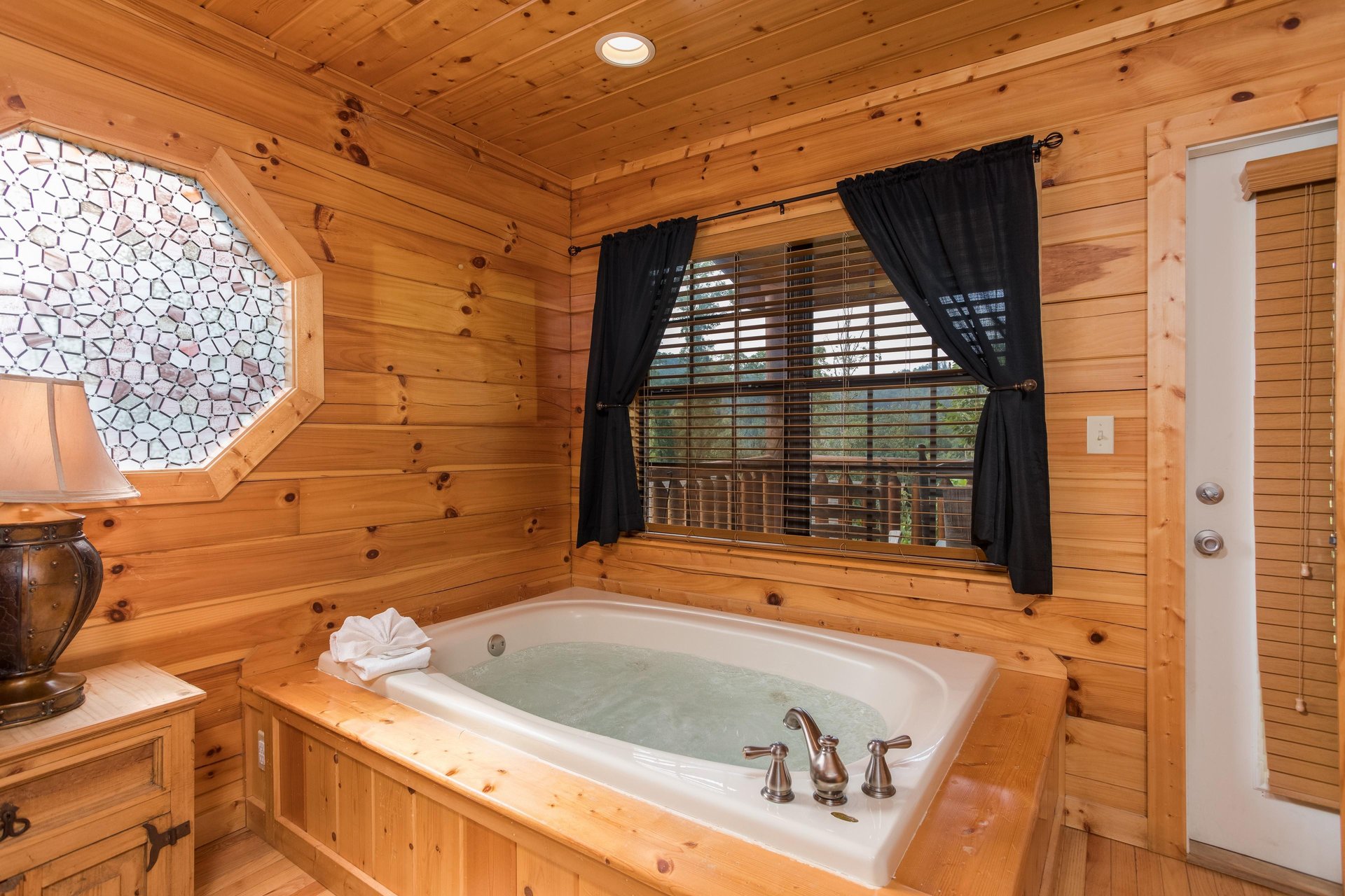 Jacuzzi in a bedroom Kick Back  Relax A 4 bedroom cabin rental located in Pigeon Forge