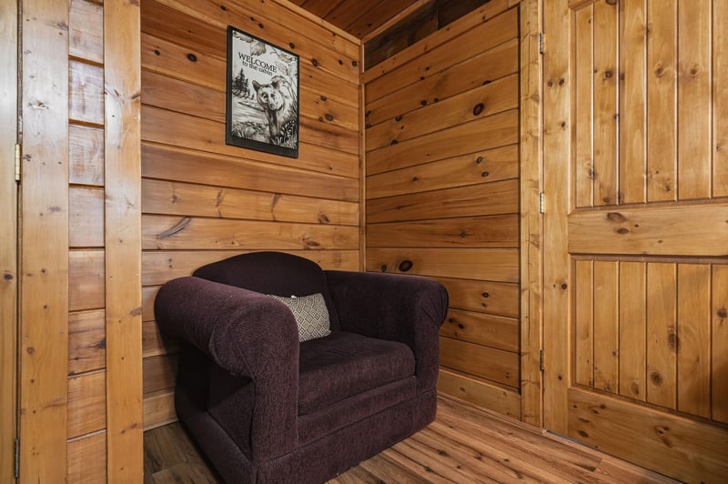 Cozy nook in warm knotty pine, perfect for your quiet moments with a book or morning coffee.