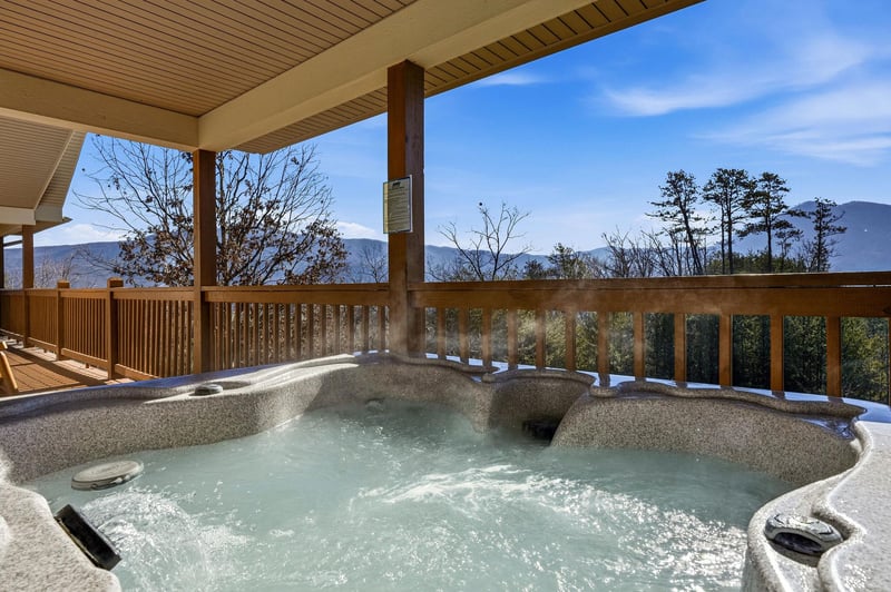 Soak in your private hot tub while taking in breathtaking mountain views from this peaceful covered terrace.
