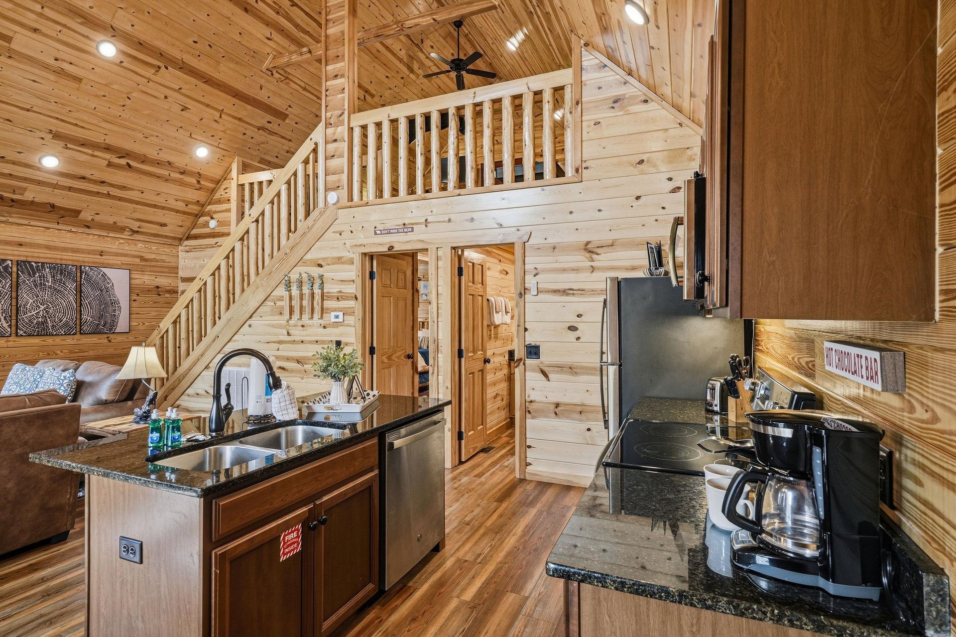 Step into your openconcept cabin retreat, where soaring ceilings, warm wood tones, and a cozy loft create the perfect mountain getaway. Your fully equipped kitchen awaits your morning coffee ritual.