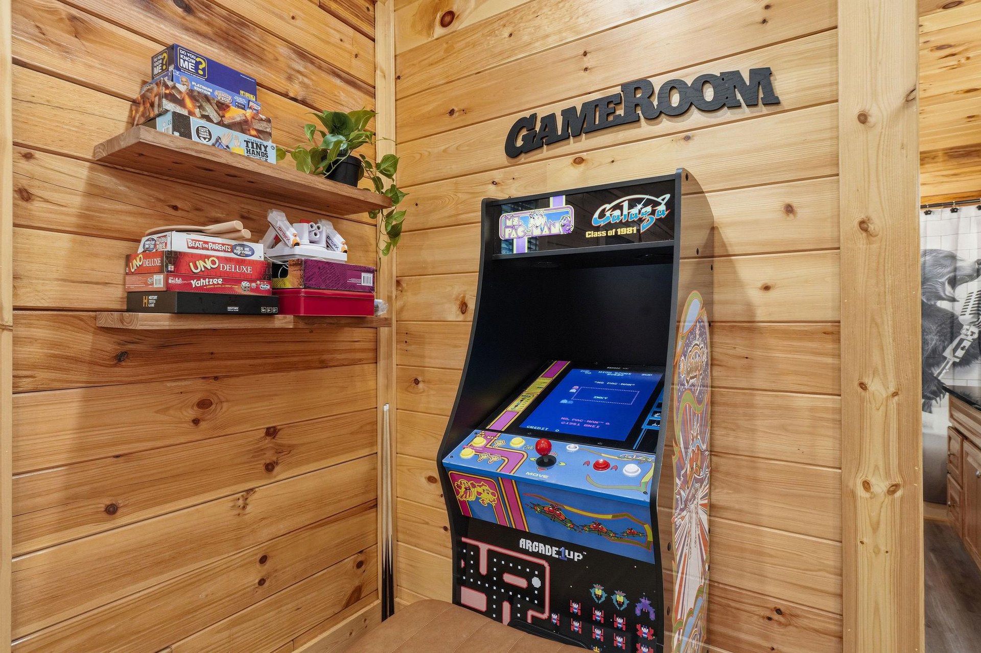 Your game room awaits Challenge your friends to classic arcade games or unwind with board games from the cozy shelves, all in this inviting woodpaneled retreat.