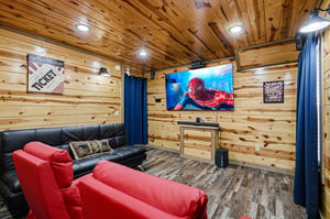 Cozy up in your private theater with rich wood walls and plush seating for epic movie nights.
