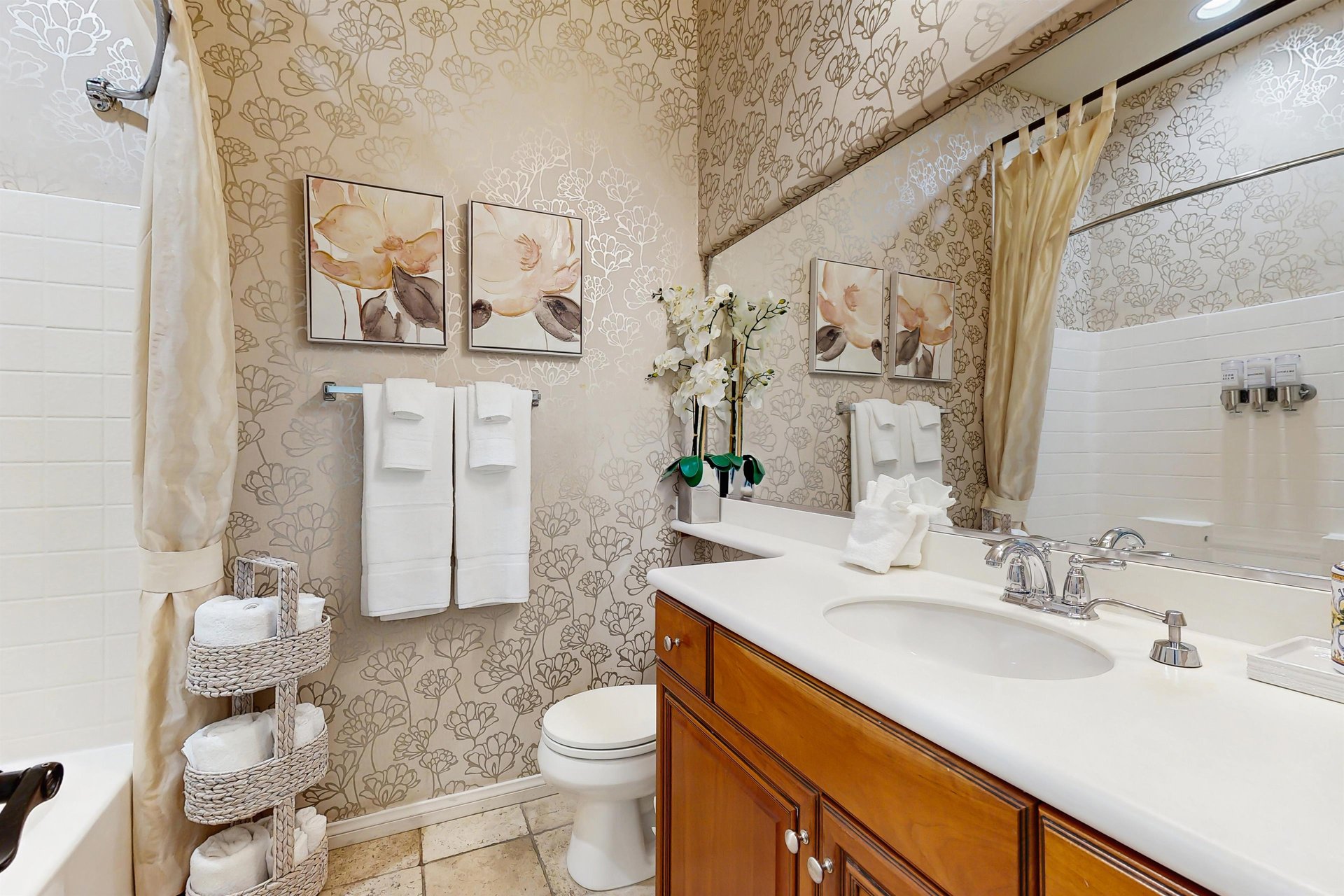 Located in the hallway with shower and tub combo.