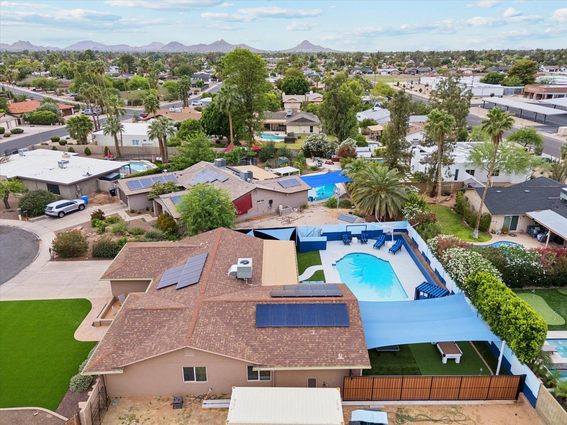 Aerial view of the side of the home and backyard.