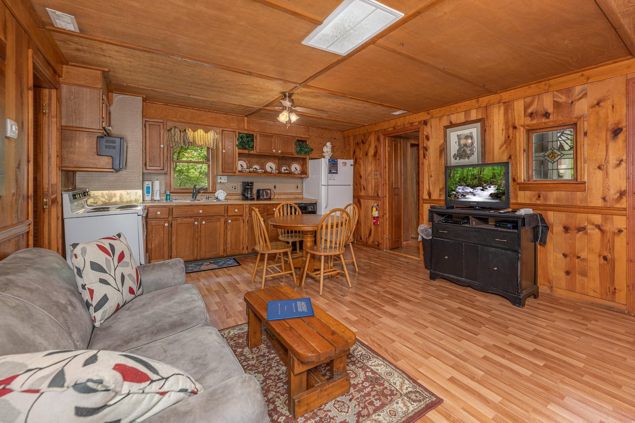 Living, dining, and kitchen space at Heavenly Hideaway, a 2bedroom cabin rental located in Gatlinburg