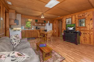Living, dining, and kitchen space at Heavenly Hideaway, a 2bedroom cabin rental located in Gatlinburg