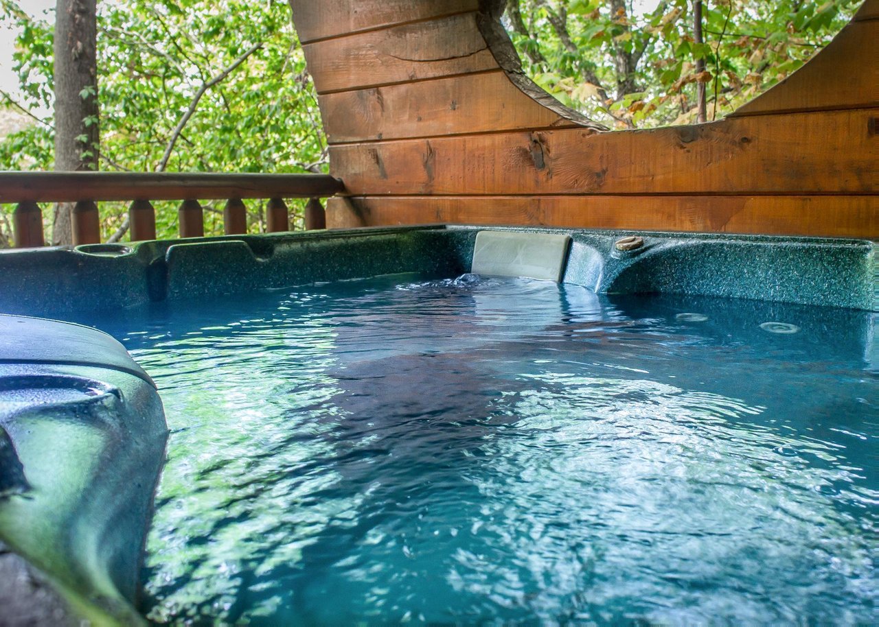 Step outside to the deck, which includes a hot tub, propane grill, picnic table and rocking chairs, perfect for enjoying the fresh mountain air and scenic surroundings.