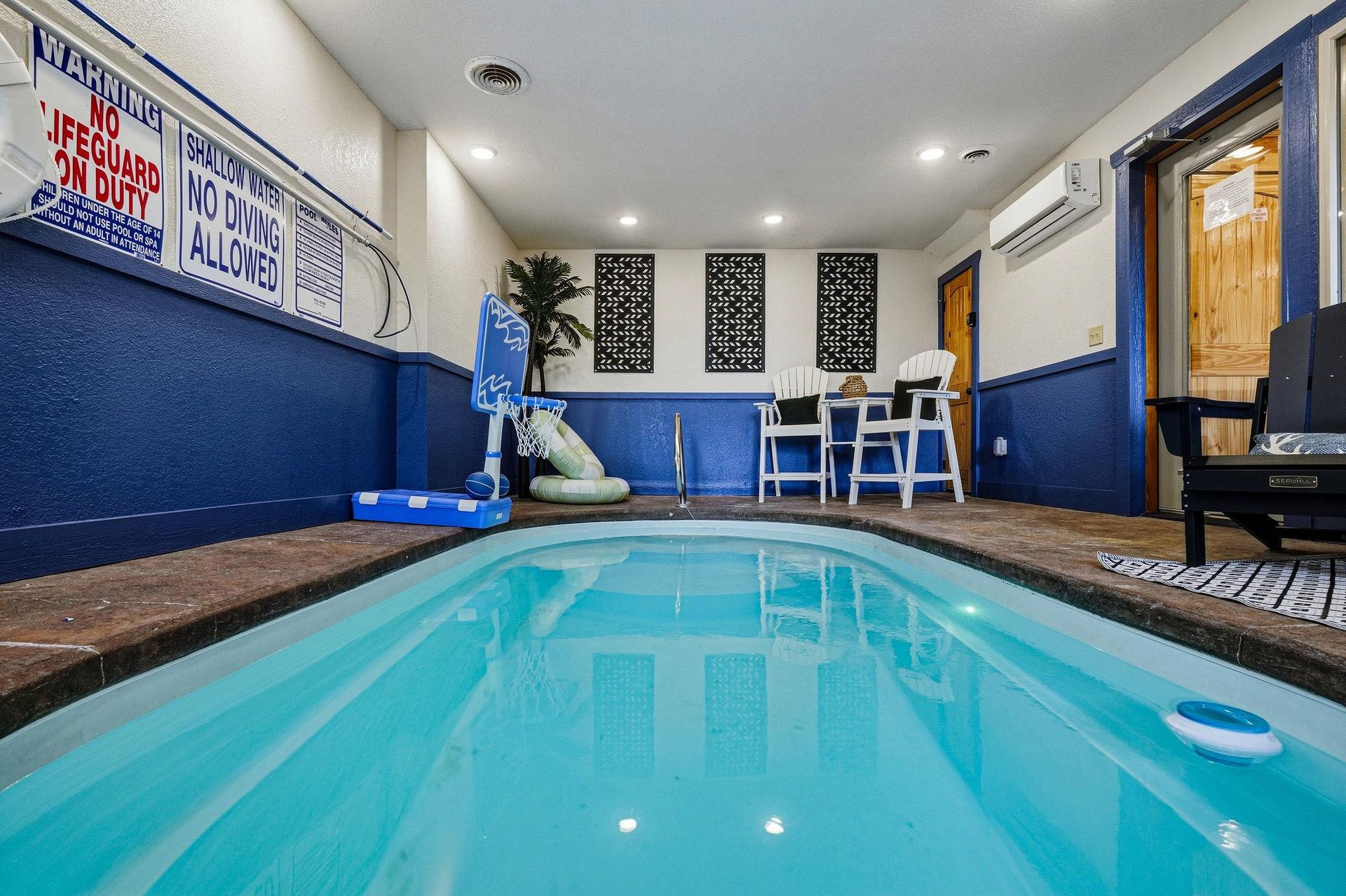 Your private indoor pool awaits with a fun basketball hoop, cozy seating, and climate control for yearround enjoyment.
