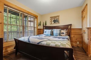 Drift off peacefully in your cozy bedroom, surrounded by warm wood tones and charming bearthemed décor that creates the perfect rustic retreat.