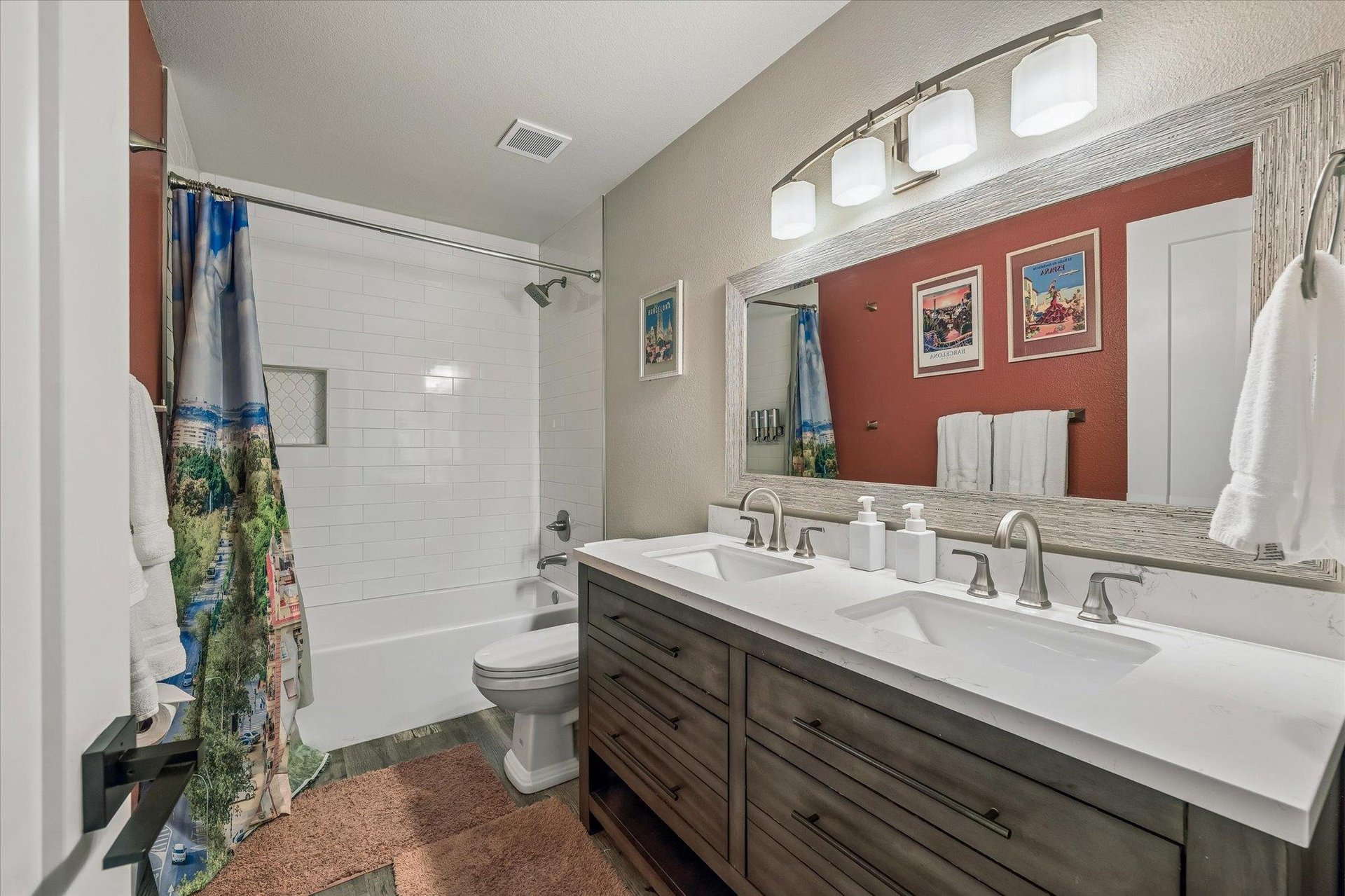 Dual vanity with a shower and tub combination.