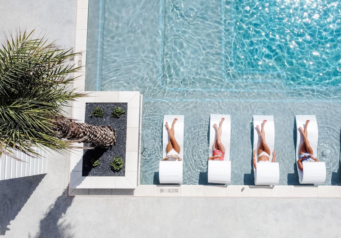 Aerial view of guests relaxing in a Cinnamon Shore resort pool in Port Aransas, Texas