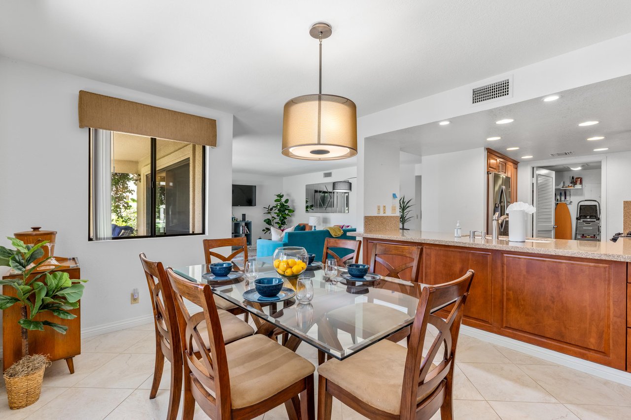 Dining space with a table and chairs for 6 guests.