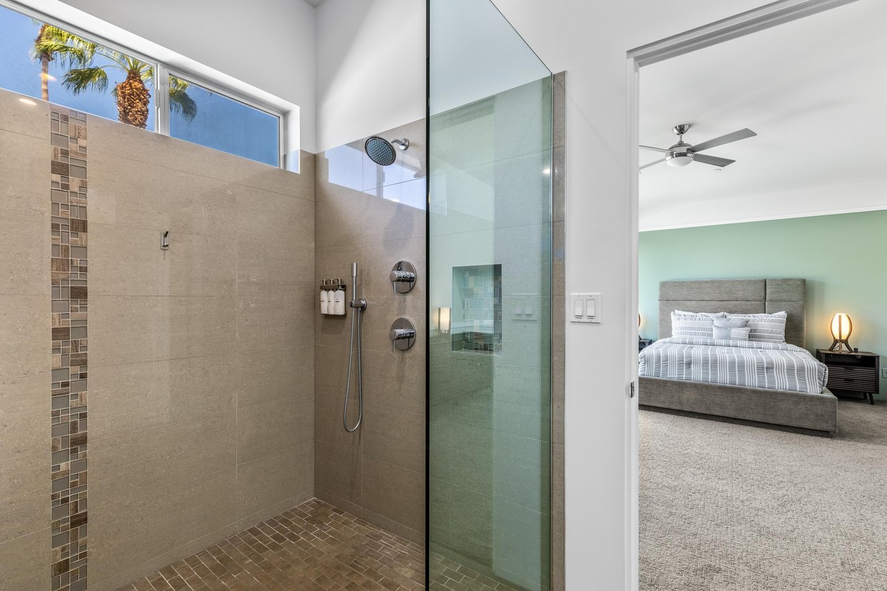 Ensuite bathroom with standalone shower and stand alone tub.