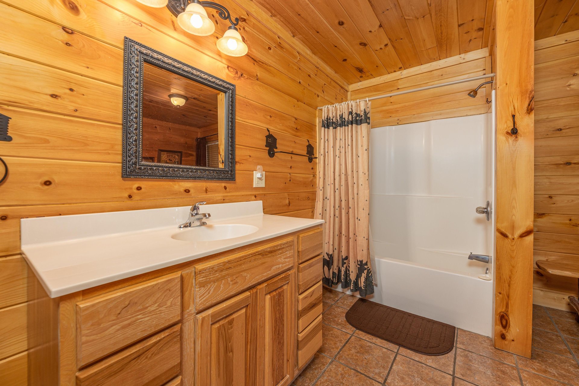 Bathroom with a tub and shower at Bears Dont Bluff, a 3 bedroom cabin rental located in Pigeon Forge