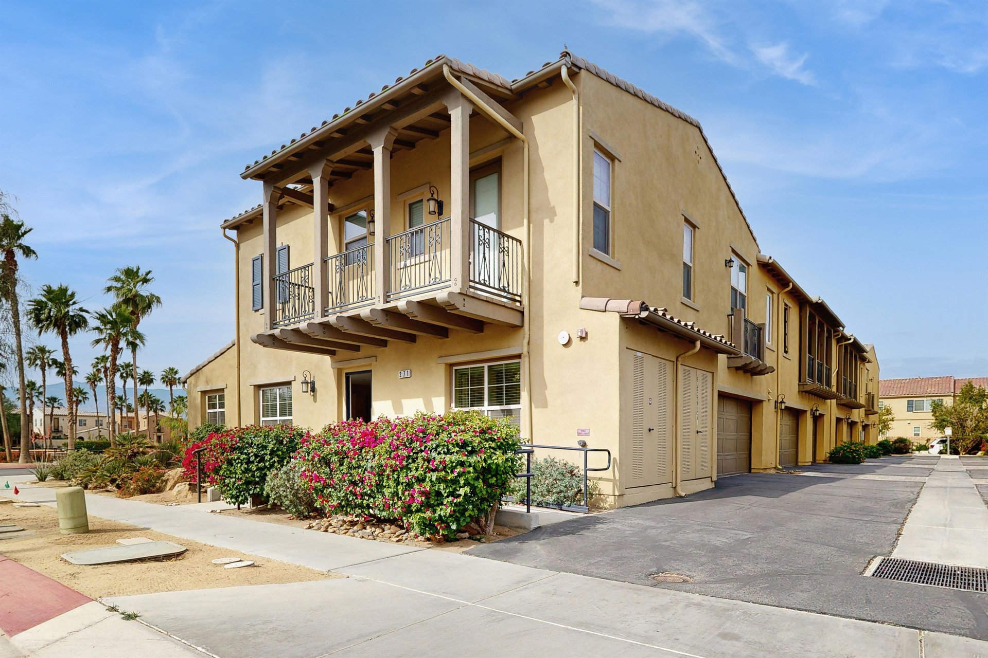 View of front door and garage space.