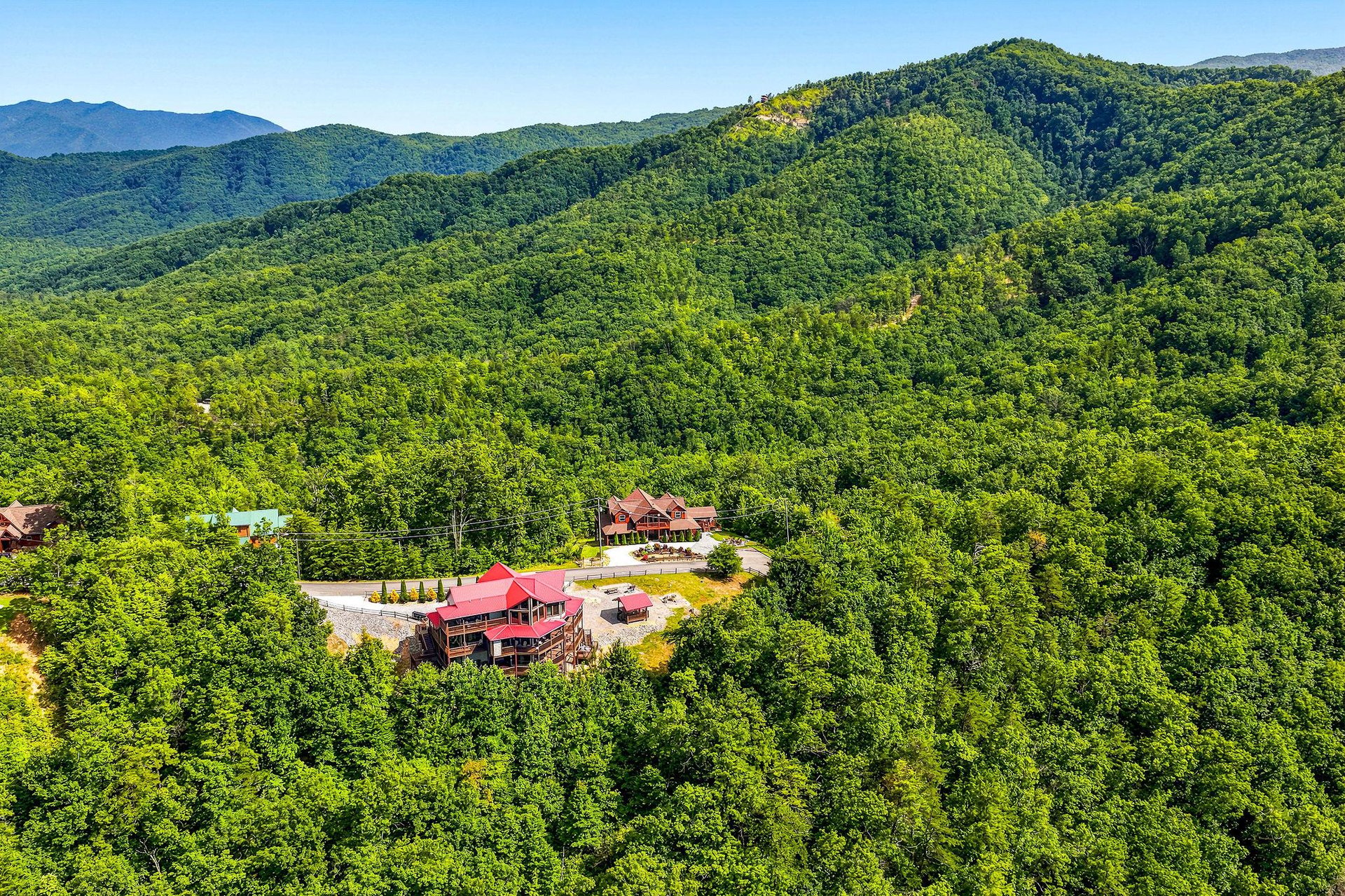 Nestled amid lush forested mountains, this property offers peaceful seclusion and natural beauty in a scenic mountain setting with convenient parking and easy access.