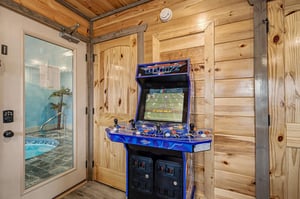 Challenge friends to arcade games in this rustic game room, then unwind in your private hot tub just steps away.