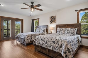 Unwind in your cozy retreat, where rustic wood accents and soft linens create the perfect haven. Natural light pours through the windows, inviting you to relax after a day of adventure.