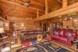 Living room with lots of seating and a sleeper sofa at Great View Lodge, a 5bedroom cabin rental located in Pigeon Forge
