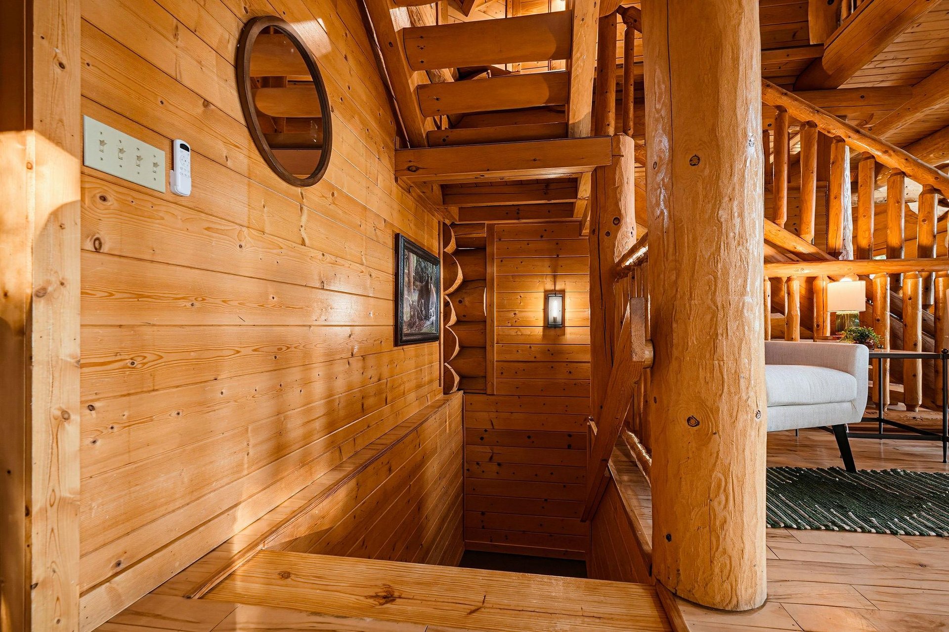 Step into your private cabin retreat, where rustic pine walls and handcrafted log beams create a warm, inviting atmosphere that feels like a true mountain escape.