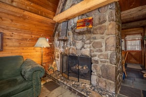 Stone fireplace at Ever After, a 1 bedroom cabin rental located in Gatlinburg