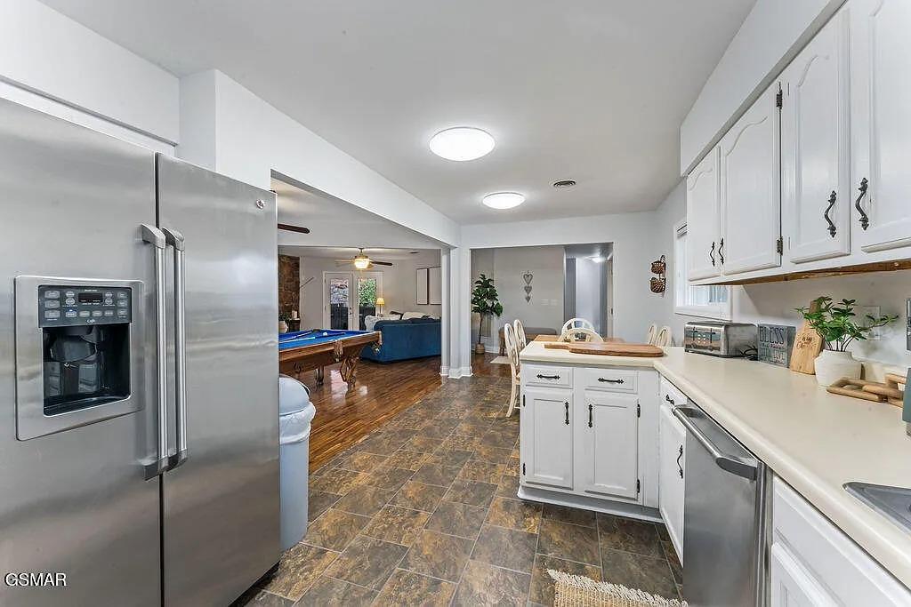 Step into your fully equipped kitchen with modern appliances and gleaming countertops, perfect for preparing meals during your stay.