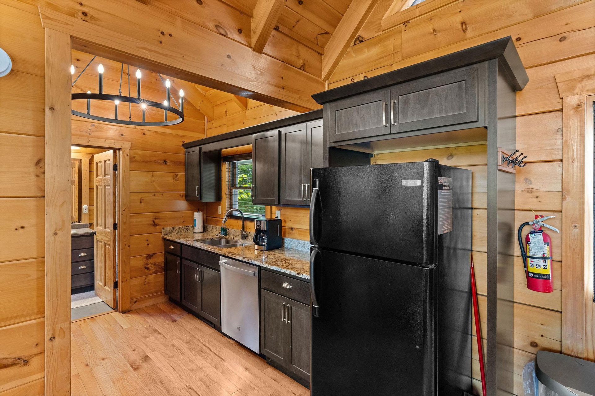 Full kitchen with dark wood cabinets