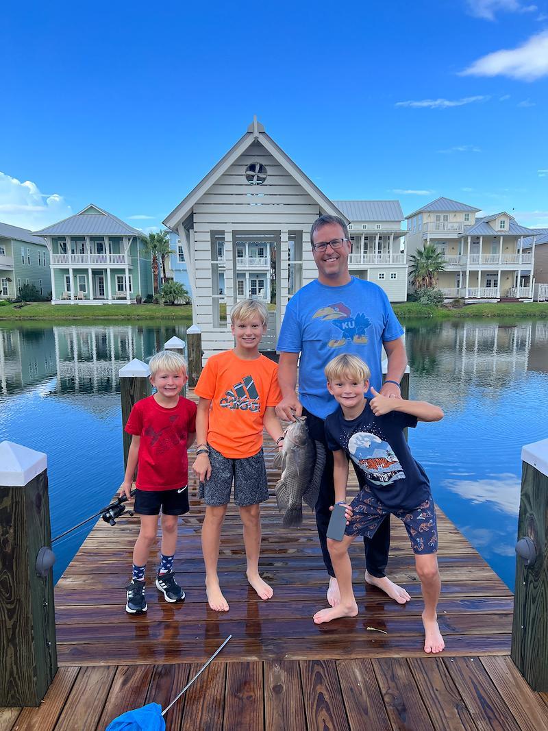 0f1bb5a9e31b4439be2d8d5afe4316dalarge_boys dad on fishing dock