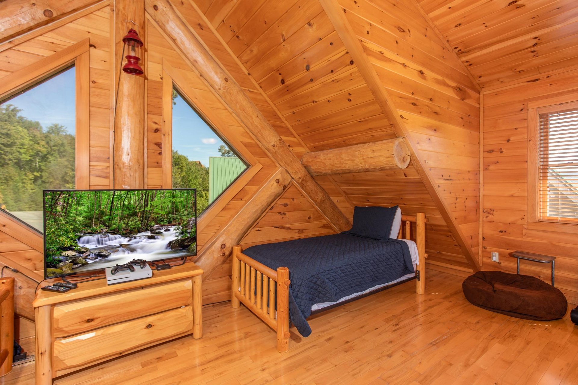 Large TV in the bunk room at Great View Lodge, a 5bedroom cabin rental located in Pigeon Forge