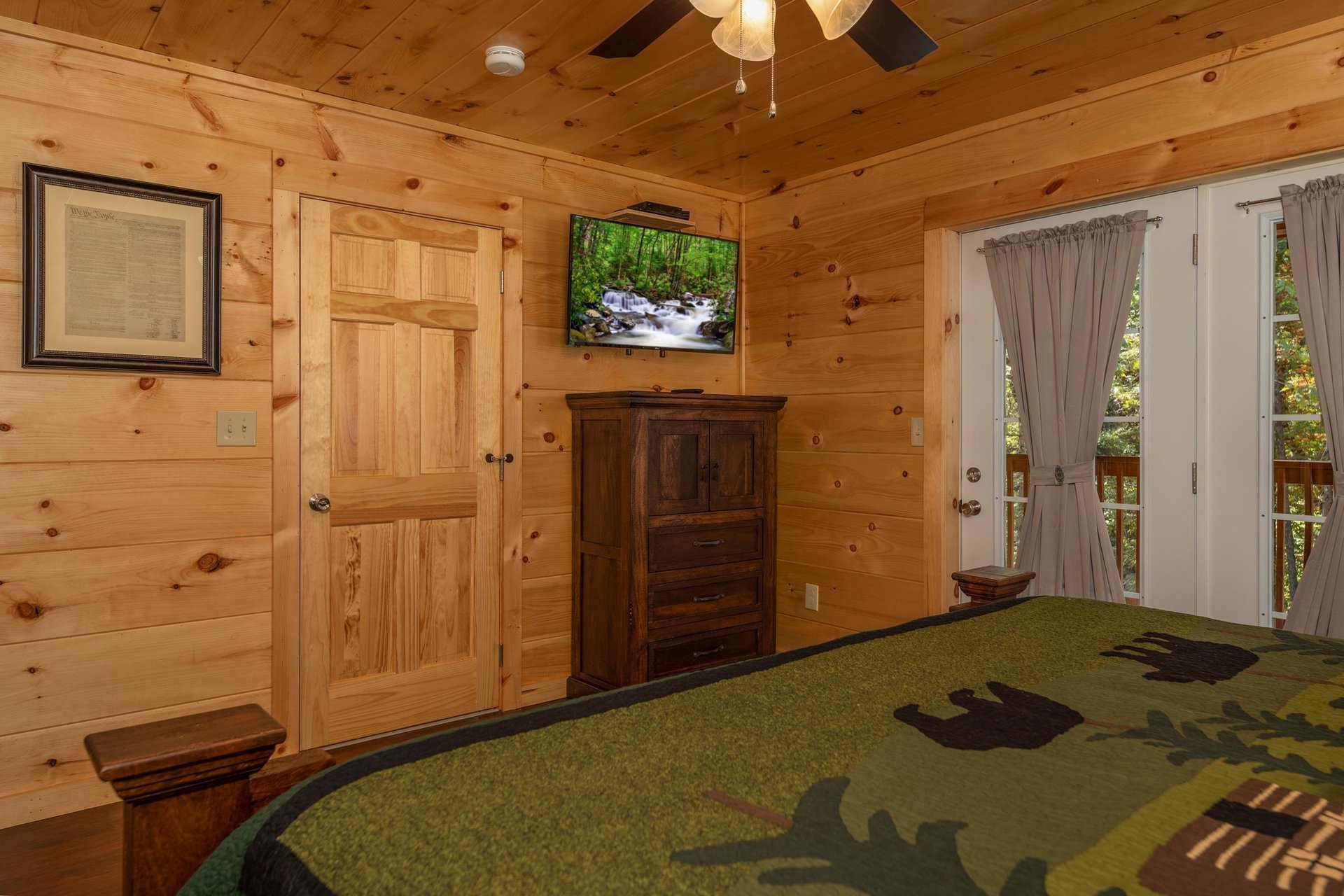 King bed facing dresser and tv