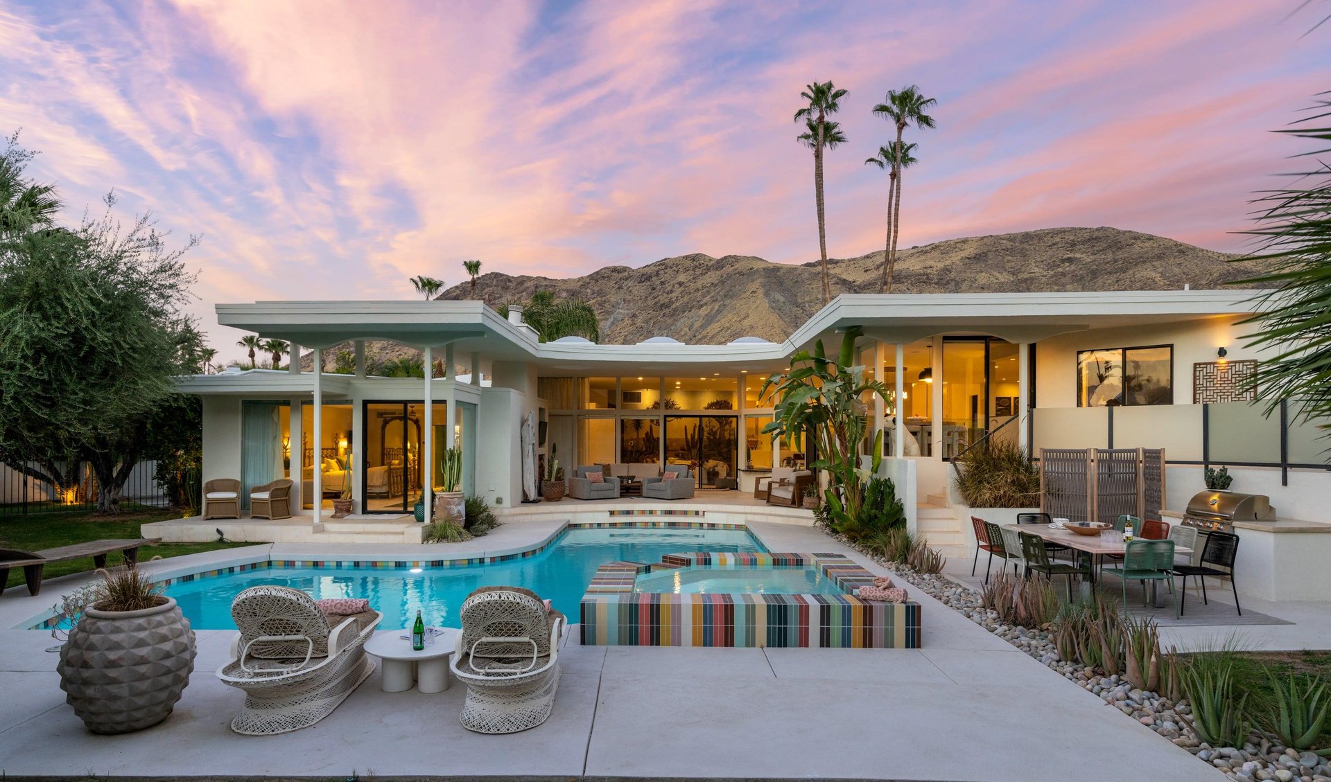 A gorgeous 4 bedroom, 5 bathroom home in Palm Springs, CA with a private pool, spa, BBQ, outdoor entertaining space, and stunning mountain views.