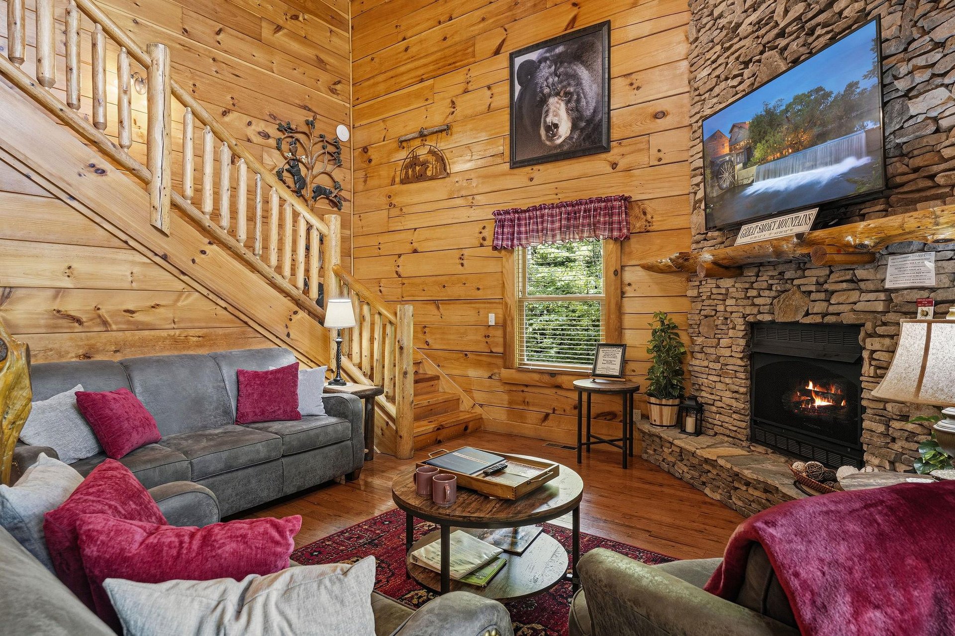 Sink into plush seating by the stone fireplace, where rustic charm meets modern comfort. Warm wood surrounds you as natural light fills the space, perfect for relaxing after your adventures.