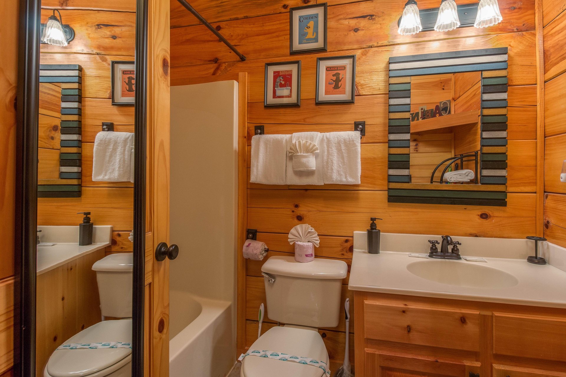 Bathroom with a tub and shower at Kellys Cabin, a 1 bedroom cabin rental located in Pigeon Forge