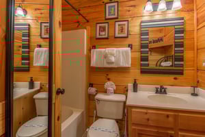 Bathroom with a tub and shower at Kellys Cabin, a 1 bedroom cabin rental located in Pigeon Forge