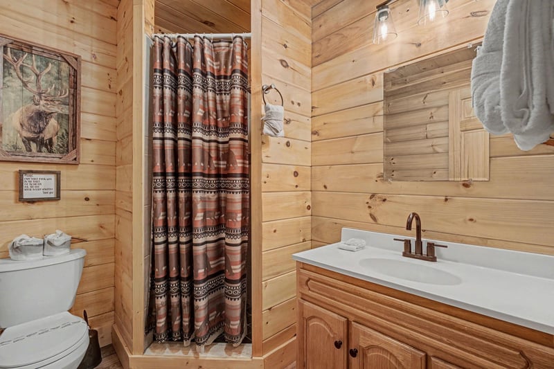 Step into your cozy cabin bathroom with rustic charm and modern comfort for a refreshing mountain retreat experience.