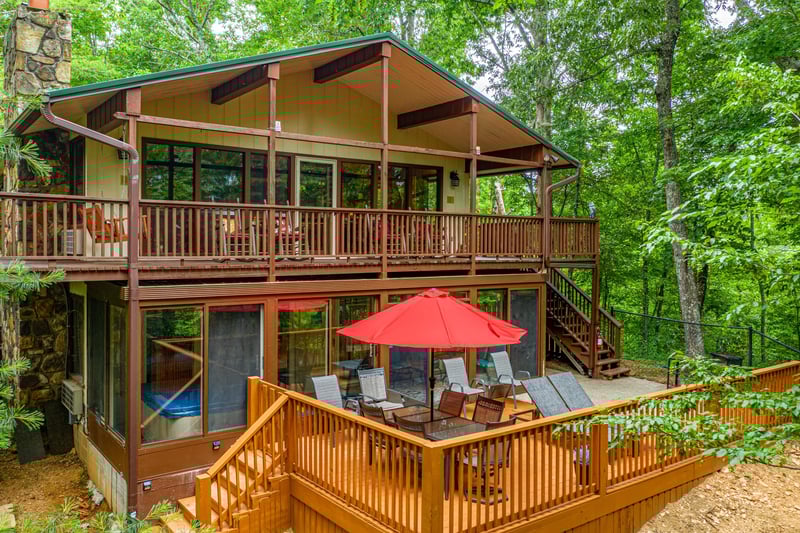 Side exterior with deck seating and outdoor eating area at Buena Vista Getaway, 3 bedroom cabin rental located in Gatlinburg