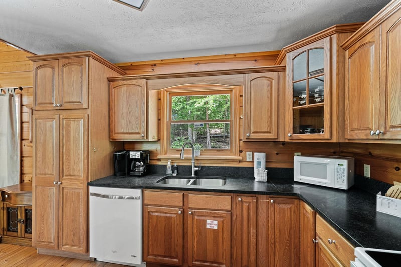 Kitchen sink with wooden cabinets