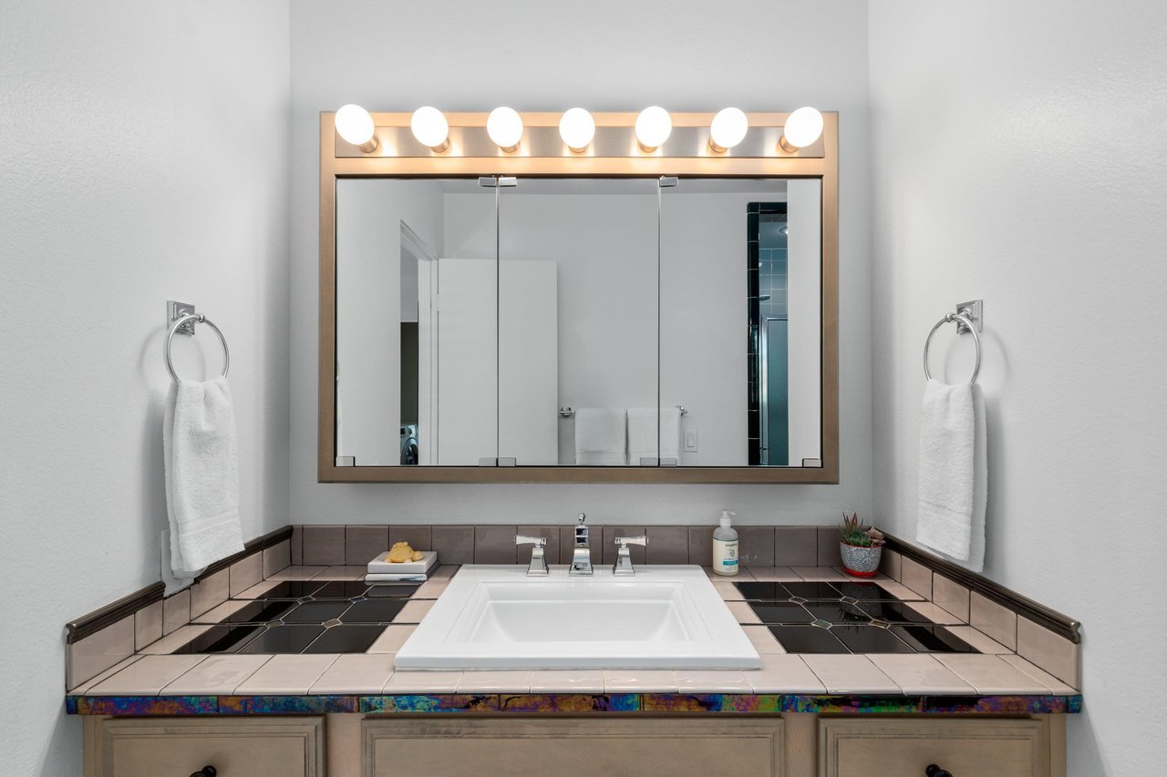 Vanity area with counter space.