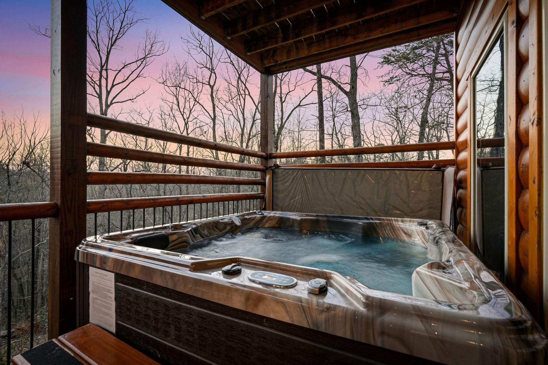Soak in your private hot tub while sunset paints the sky in dreamy pastels through the trees.