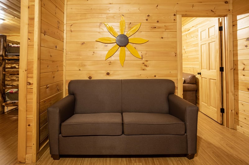 Sofa bed with wall flower decor