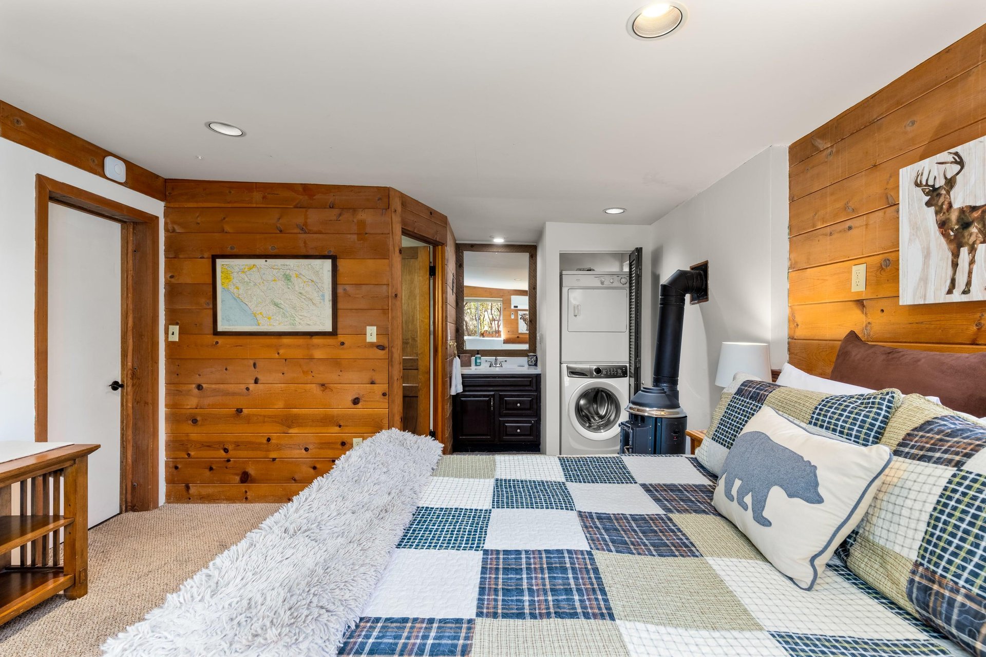 Downstairs bedroom with queen bed, remote controlled minisplit, and private entrance.