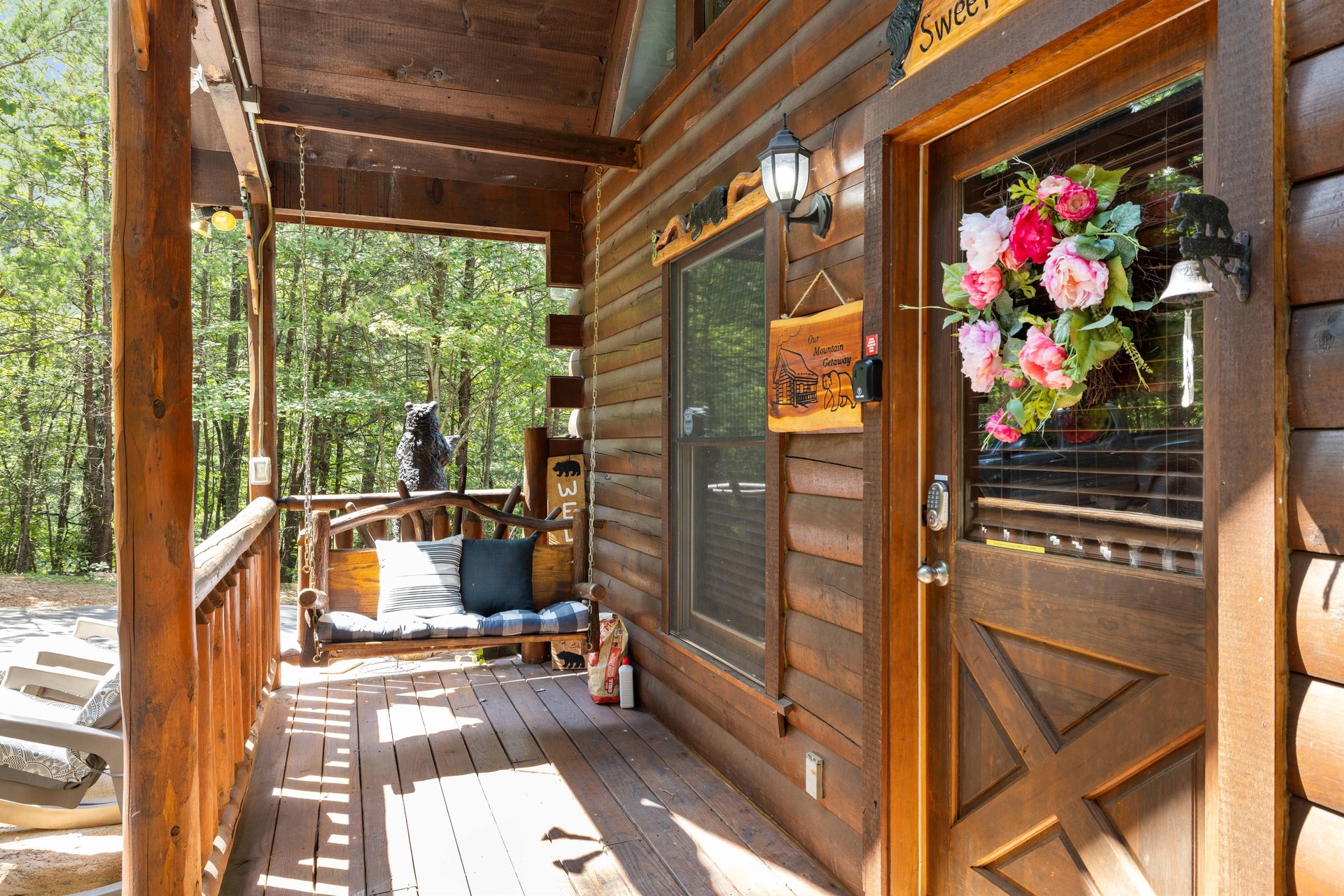 Porch swing and front door to Sweet Serenity