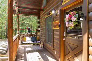 Porch swing and front door to Sweet Serenity