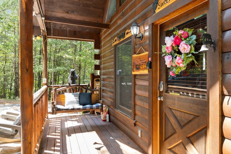 Porch swing and front door to Sweet Serenity
