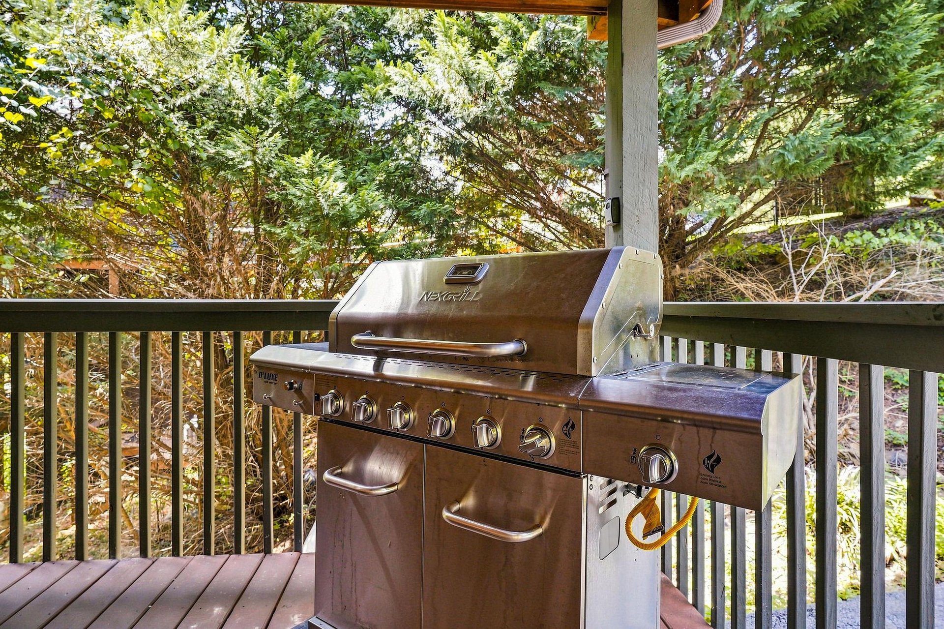 Fire up the grill and savor the fresh mountain air from your private deck surrounded by tall pines and natural greenery.