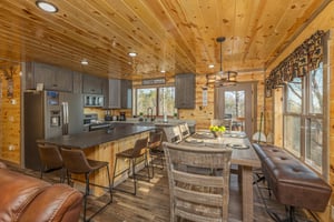 Dining table and breakfast bar at Everlys Splash, a 4 bedroom cabin rental located in Pigeon Forge