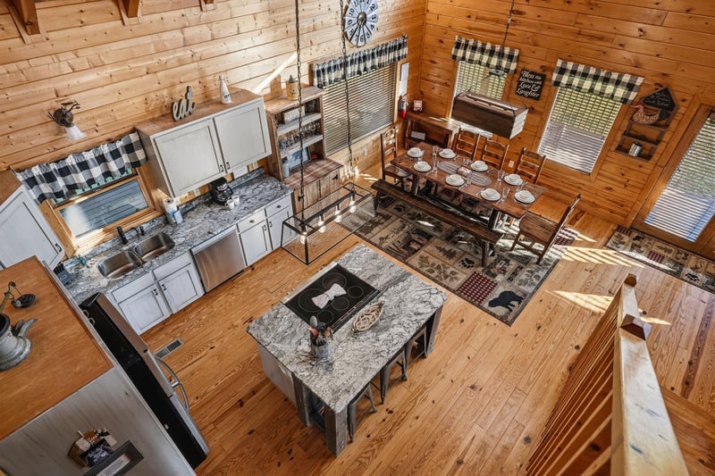Gather around the rustic dining table or whip up a homecooked meal in your fully equipped kitchen, all within this cozy, sunlit cabin with charming wood details and mountain lodge ambiance.