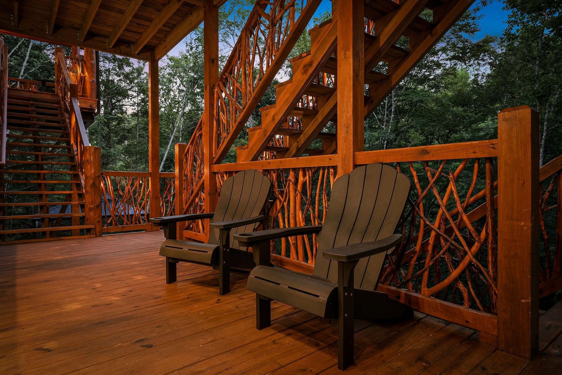 Picture yourself unwinding in these cozy Adirondack chairs, surrounded by beautiful woodwork and mountain air. Your own peaceful retreat awaits under this charming covered deck.