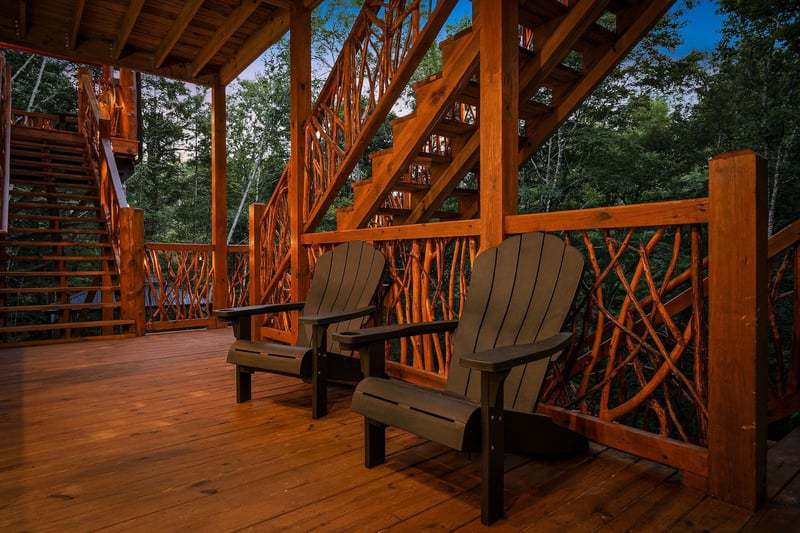 Picture yourself unwinding in these cozy Adirondack chairs, surrounded by beautiful woodwork and mountain air. Your own peaceful retreat awaits under this charming covered deck.
