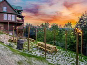 Lighted area with picnic table and grill